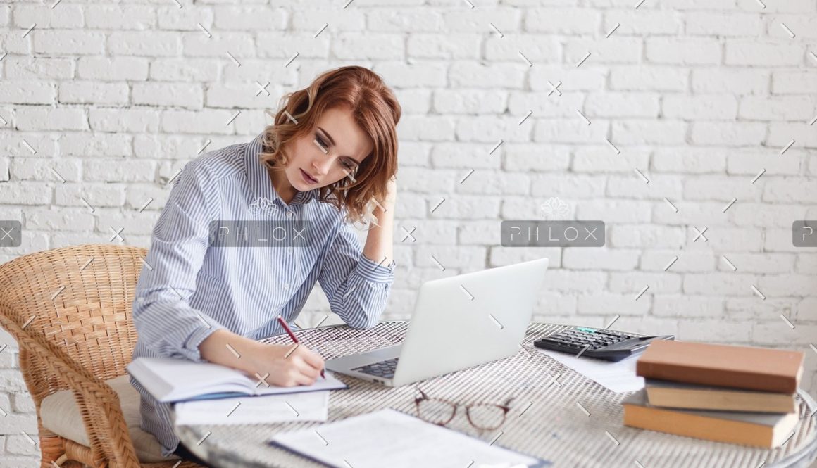 woman-freelancer-female-hands-with-pen-writing-on-P369BAX1